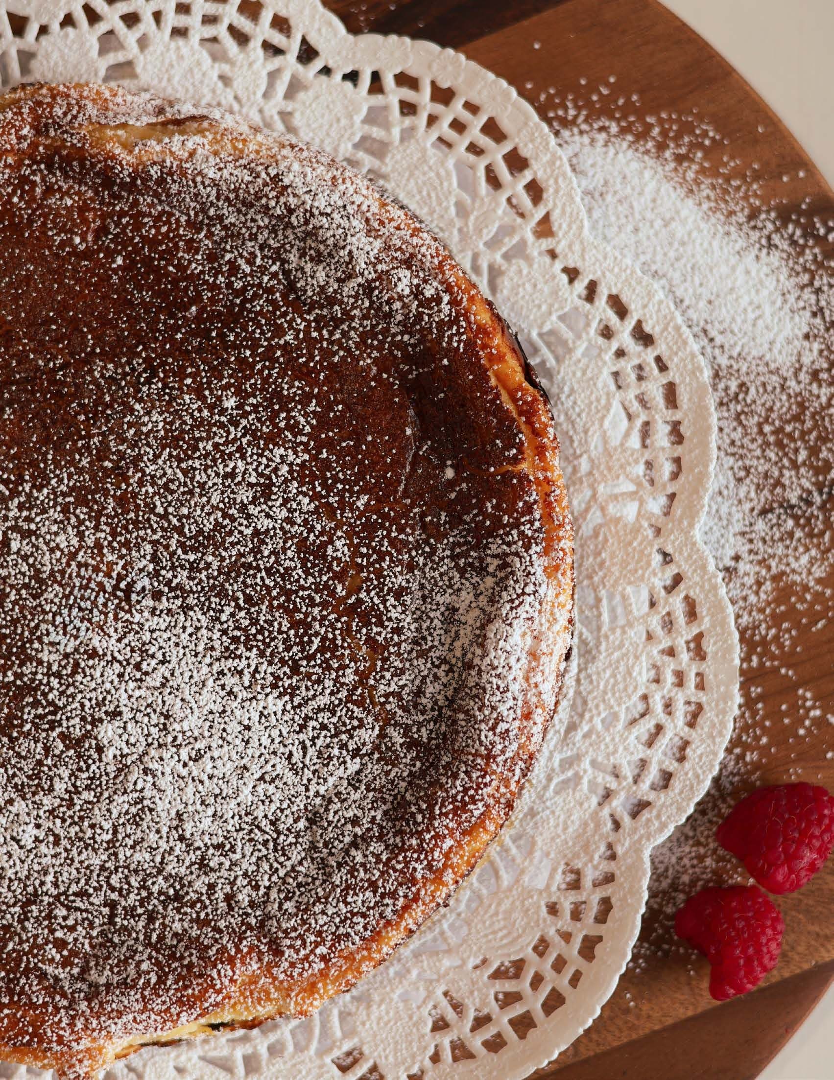 Basque cheesecake dusted with powdered sugar